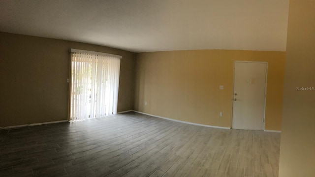 empty room featuring wood-type flooring