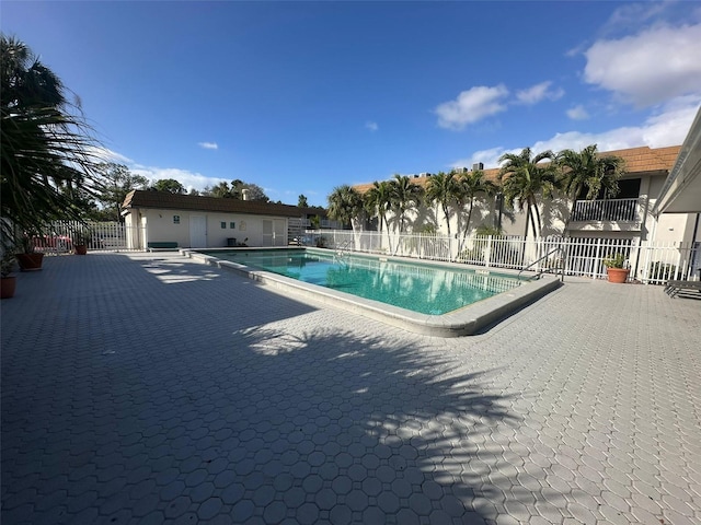 view of swimming pool with a patio