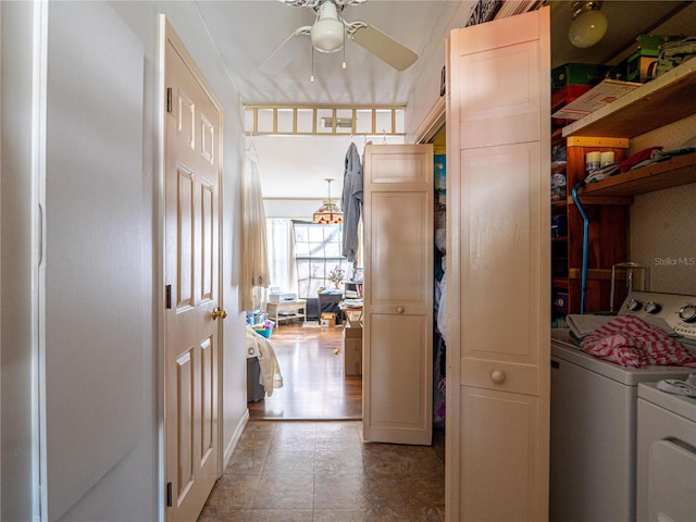 hall with washer and clothes dryer