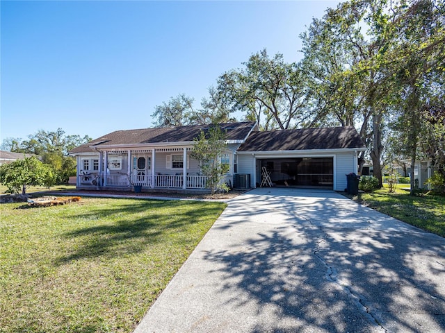 single story home with a garage, covered porch, a front yard, and cooling unit