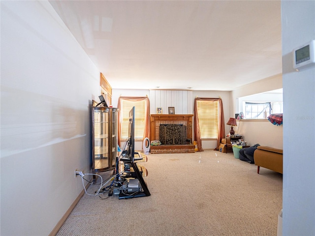 exercise area with carpet flooring and a brick fireplace