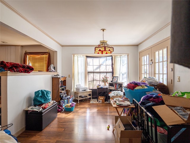 interior space featuring wood-type flooring and ornamental molding