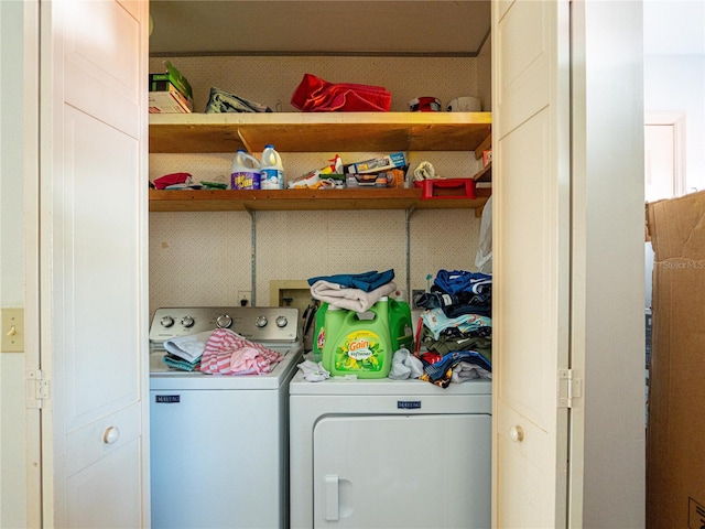 laundry area with independent washer and dryer