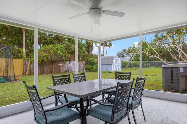 sunroom featuring ceiling fan