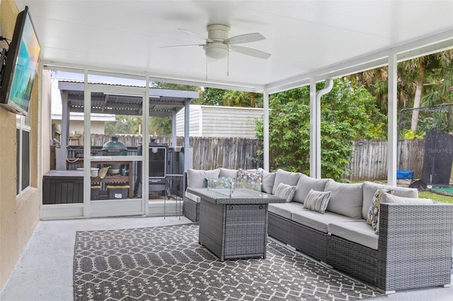 sunroom with ceiling fan and a healthy amount of sunlight