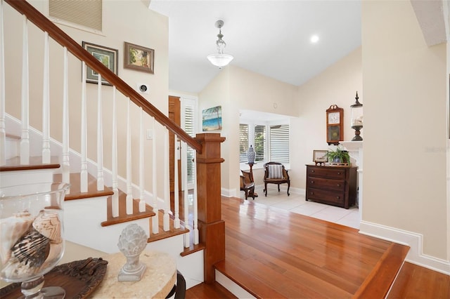 foyer featuring light hardwood / wood-style floors and vaulted ceiling