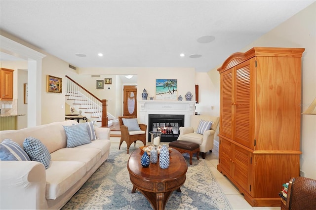 300 Spring Run Cir, Longwood, FL 32779 - living room featuring stairs, recessed lighting, light tile patterned floors, and a glass covered fireplace