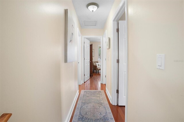 300 Spring Run Cir, Longwood, FL 32779 - hall featuring wood finished floors, baseboards, and attic access