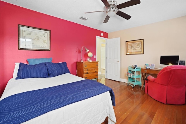 bedroom with ceiling fan and wood-type flooring