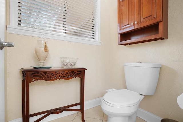 bathroom with tile patterned flooring and toilet