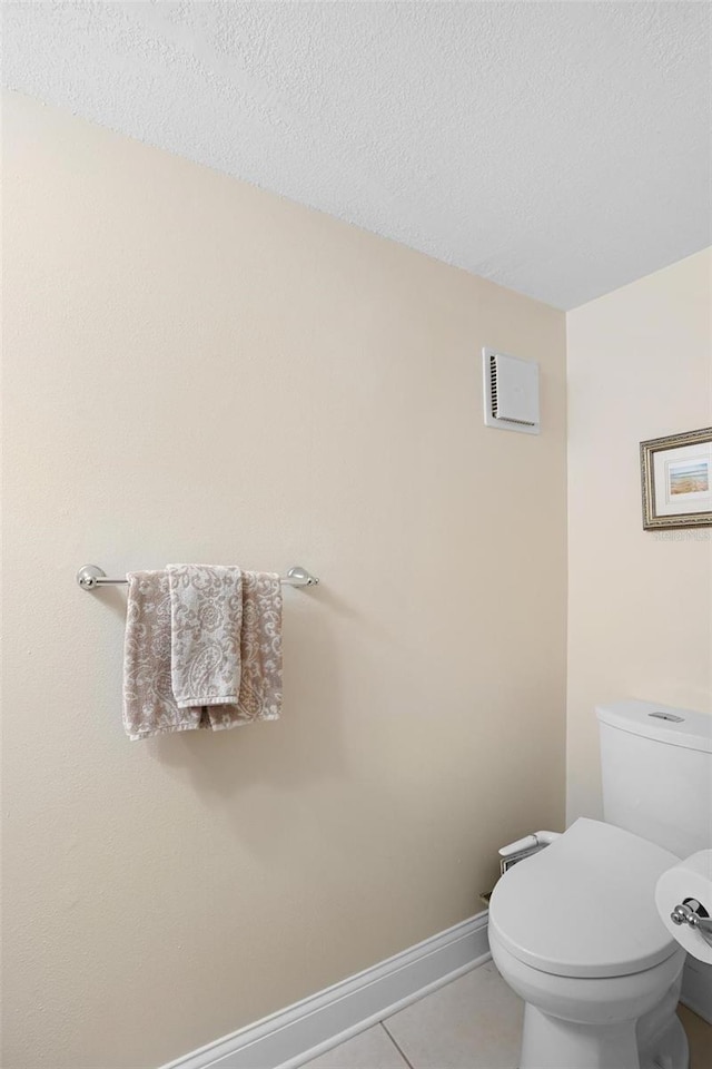 300 Spring Run Cir, Longwood, FL 32779 - bathroom with tile patterned floors, a textured ceiling, toilet, and baseboards