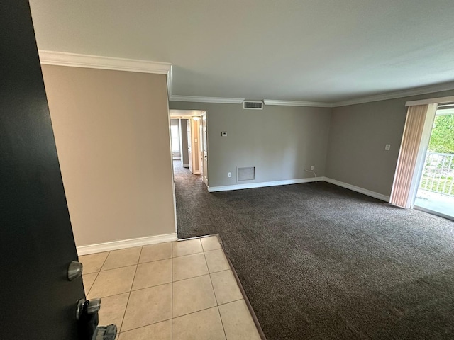 carpeted spare room featuring ornamental molding