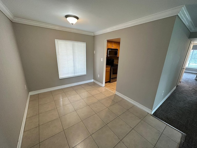 tiled spare room with ornamental molding