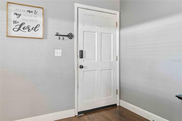 entryway with dark wood-type flooring