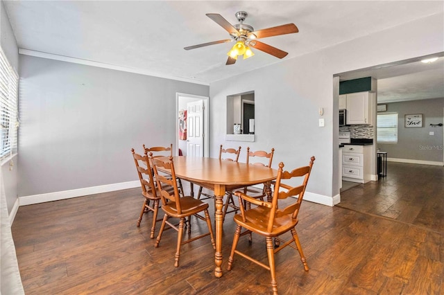 dining room with ceiling fan, dark hardwood / wood-style floors, and ornamental molding