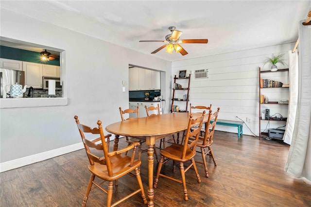 dining room with ceiling fan, a wall mounted air conditioner, wood walls, and dark hardwood / wood-style floors