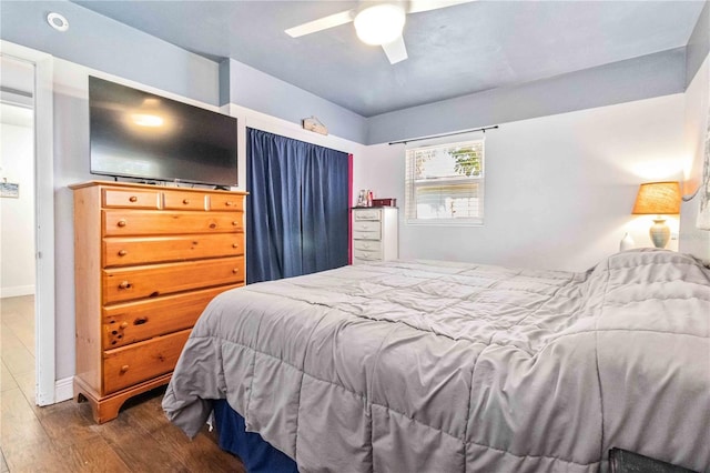 bedroom featuring dark hardwood / wood-style flooring and ceiling fan