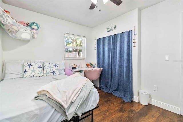 bedroom featuring ceiling fan and dark hardwood / wood-style floors