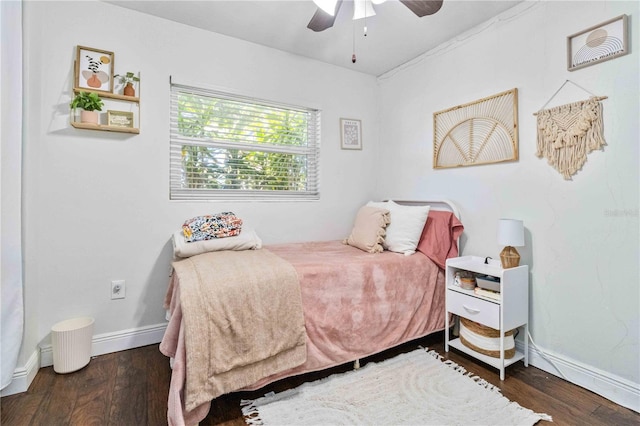 bedroom featuring ceiling fan and dark hardwood / wood-style floors