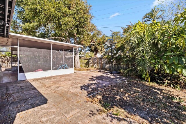 view of patio / terrace featuring a sunroom