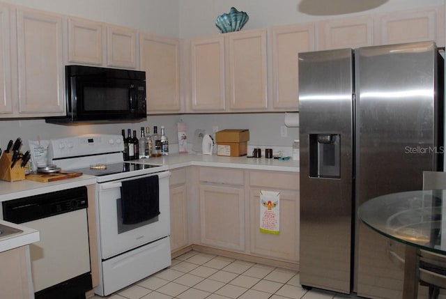 kitchen featuring white appliances and light tile patterned floors