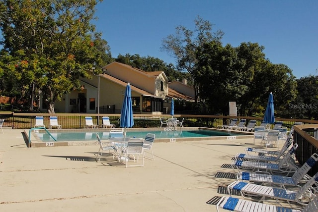 view of swimming pool featuring a patio