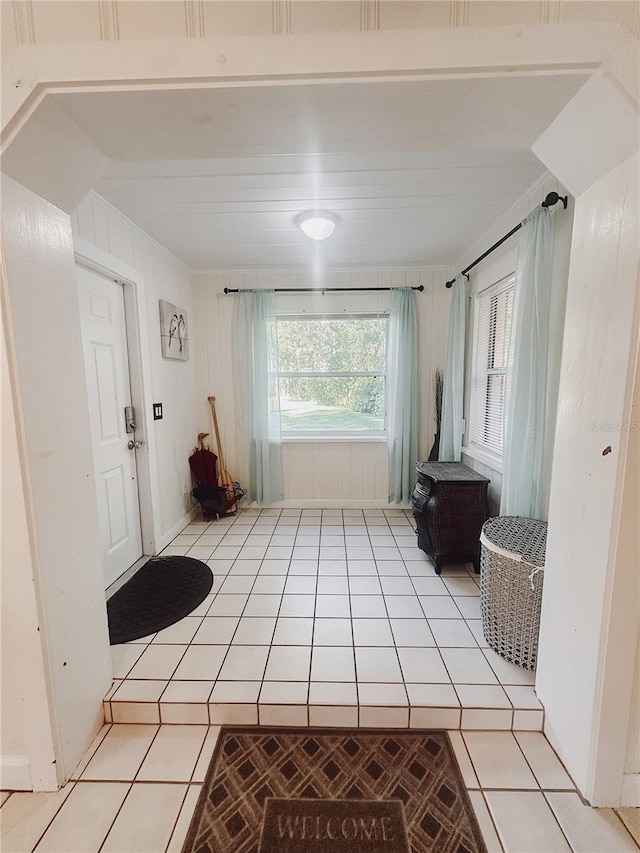 doorway with light tile patterned floors