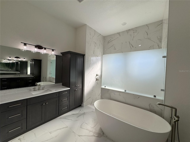 bathroom with vanity and a bathing tub