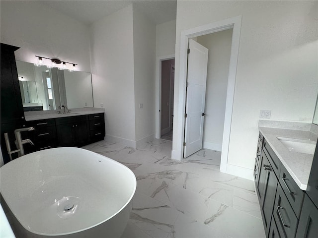 bathroom with a washtub and vanity