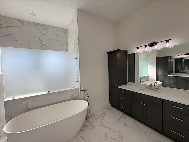 bathroom featuring vanity and a tub