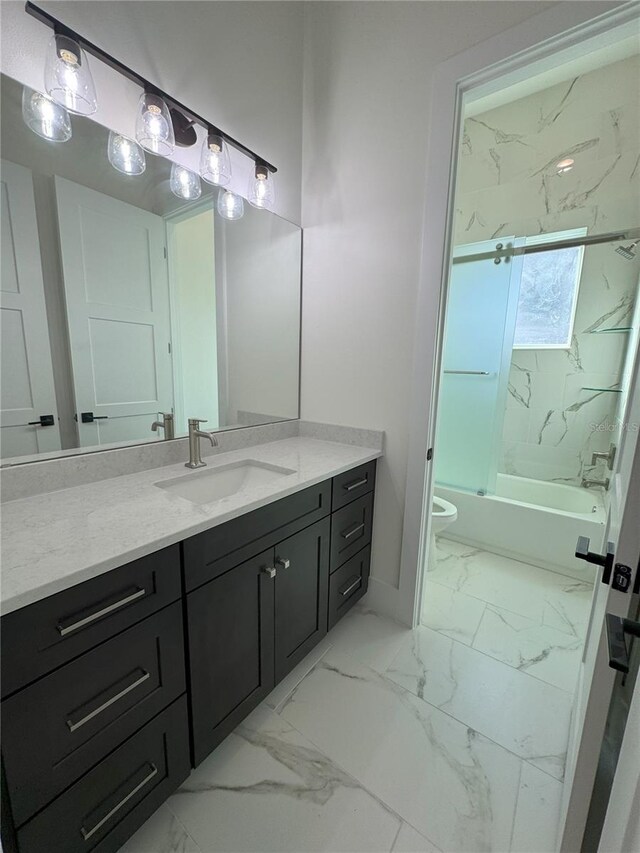 full bathroom with tiled shower / bath combo, toilet, and vanity