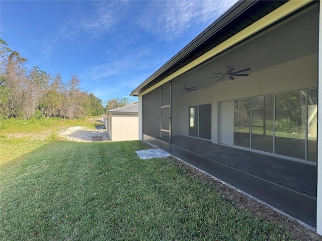 view of yard with ceiling fan