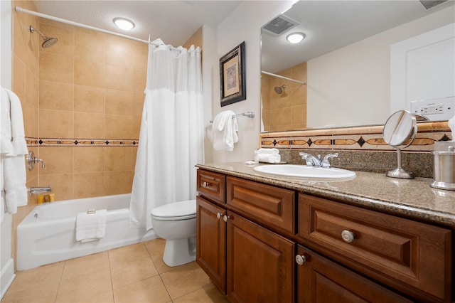 full bathroom featuring tile patterned flooring, shower / tub combo, vanity, and toilet