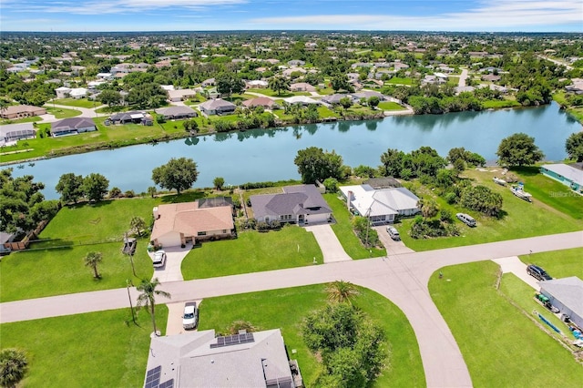 bird's eye view featuring a water view and a residential view