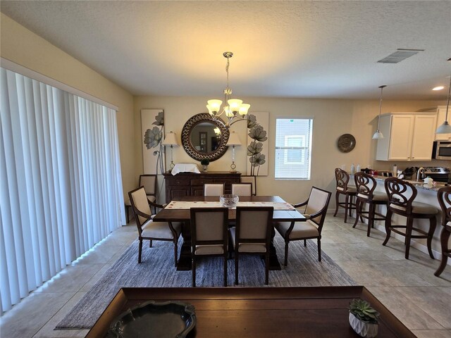 9037 Shadow Mountain St, Davenport, FL 33896 - dining area featuring a chandelier