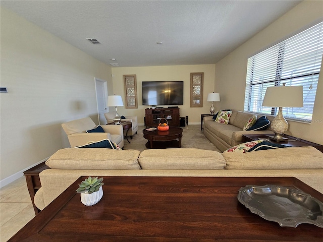 living room with light tile patterned floors