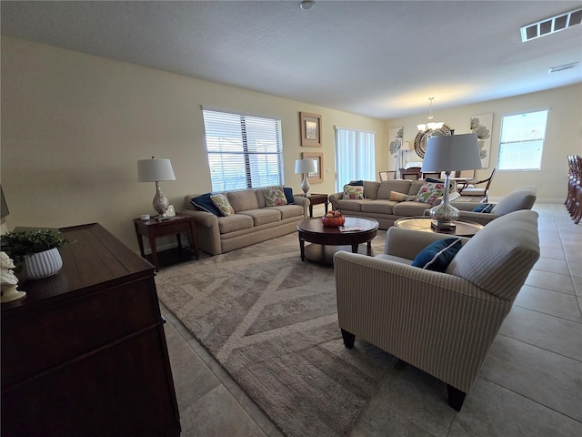 9037 Shadow Mountain St, Davenport, FL 33896 - living room featuring a chandelier