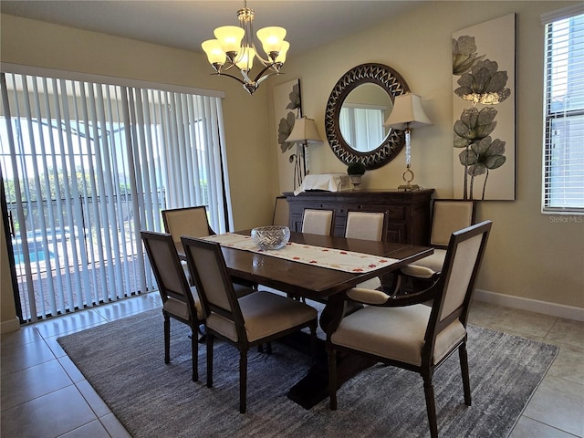 dining space featuring a chandelier and light tile patterned flooring