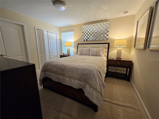 carpeted bedroom with a textured ceiling