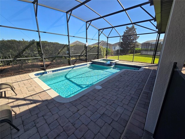 9037 Shadow Mountain St, Davenport, FL 33896 - view of swimming pool with a patio area, a pool with connected hot tub, glass enclosure, and a lawn