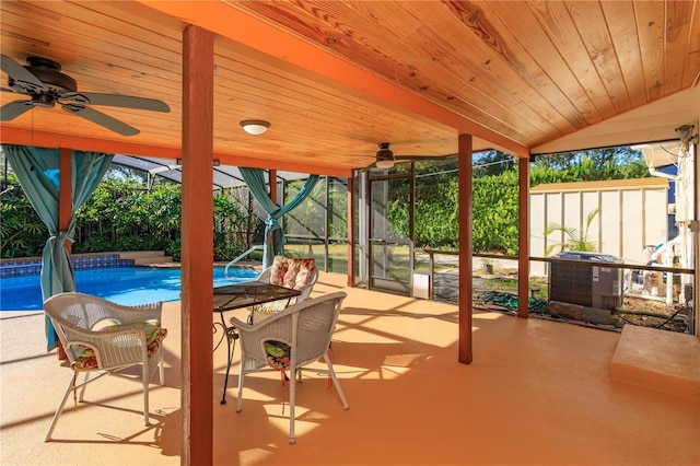 view of patio / terrace featuring central AC unit and a lanai