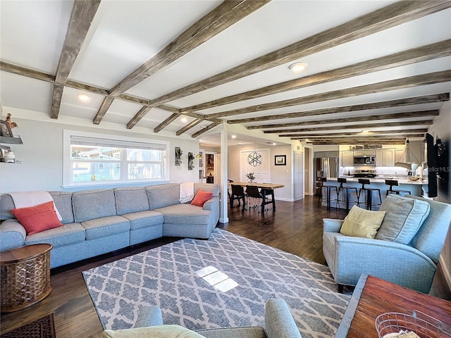 living room featuring dark hardwood / wood-style floors and beam ceiling