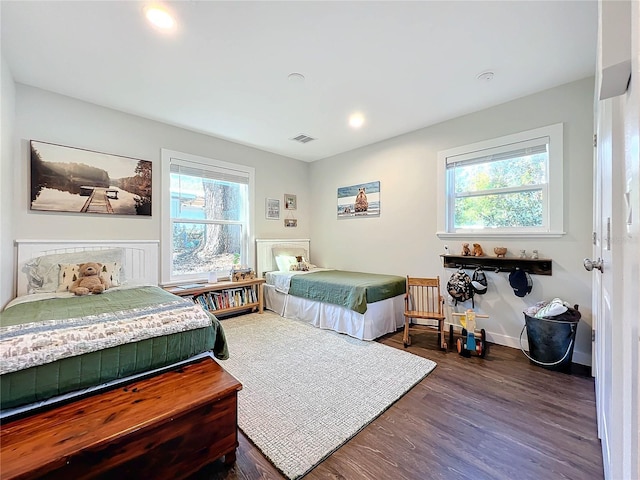 bedroom featuring dark wood-type flooring