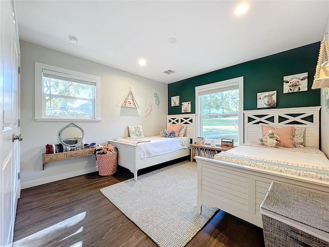 bedroom featuring dark hardwood / wood-style flooring