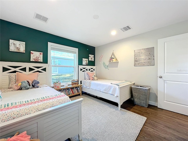 bedroom featuring wood-type flooring