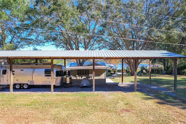 view of parking / parking lot with a yard