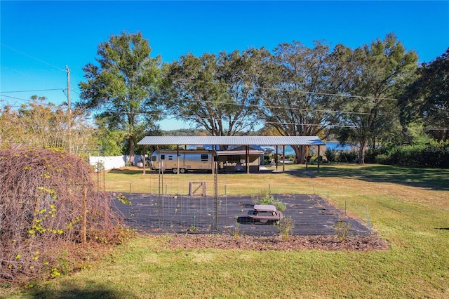 view of yard with a carport