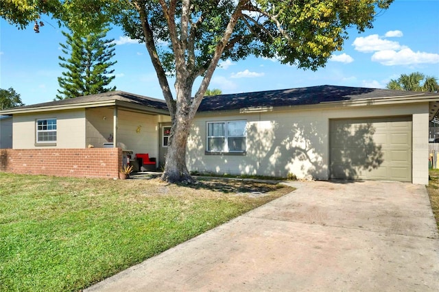 view of front of house with a front lawn and a garage