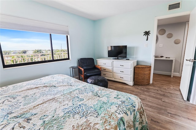 bedroom featuring hardwood / wood-style flooring