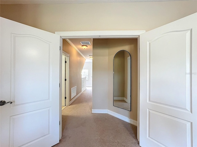 corridor with light carpet and ornamental molding